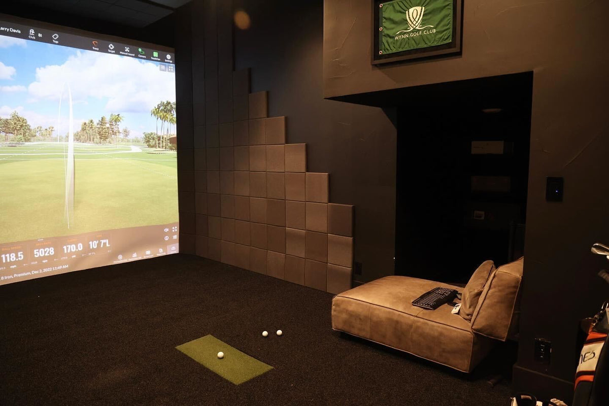 Built in golf simulator in a finished basement lounge
